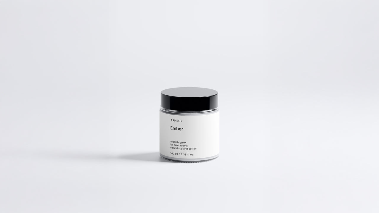 Arneux EMBER travel candle glass jar with black lid, sweet heather soy wax candle front view on grey background