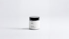Arneux EMBER travel candle glass jar with black lid, sweet heather soy wax candle front view on grey background
