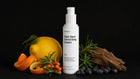 EVEN dark spot cream bottle with yuzu citrus, sea buckthorn, rosemary and blueberries on black