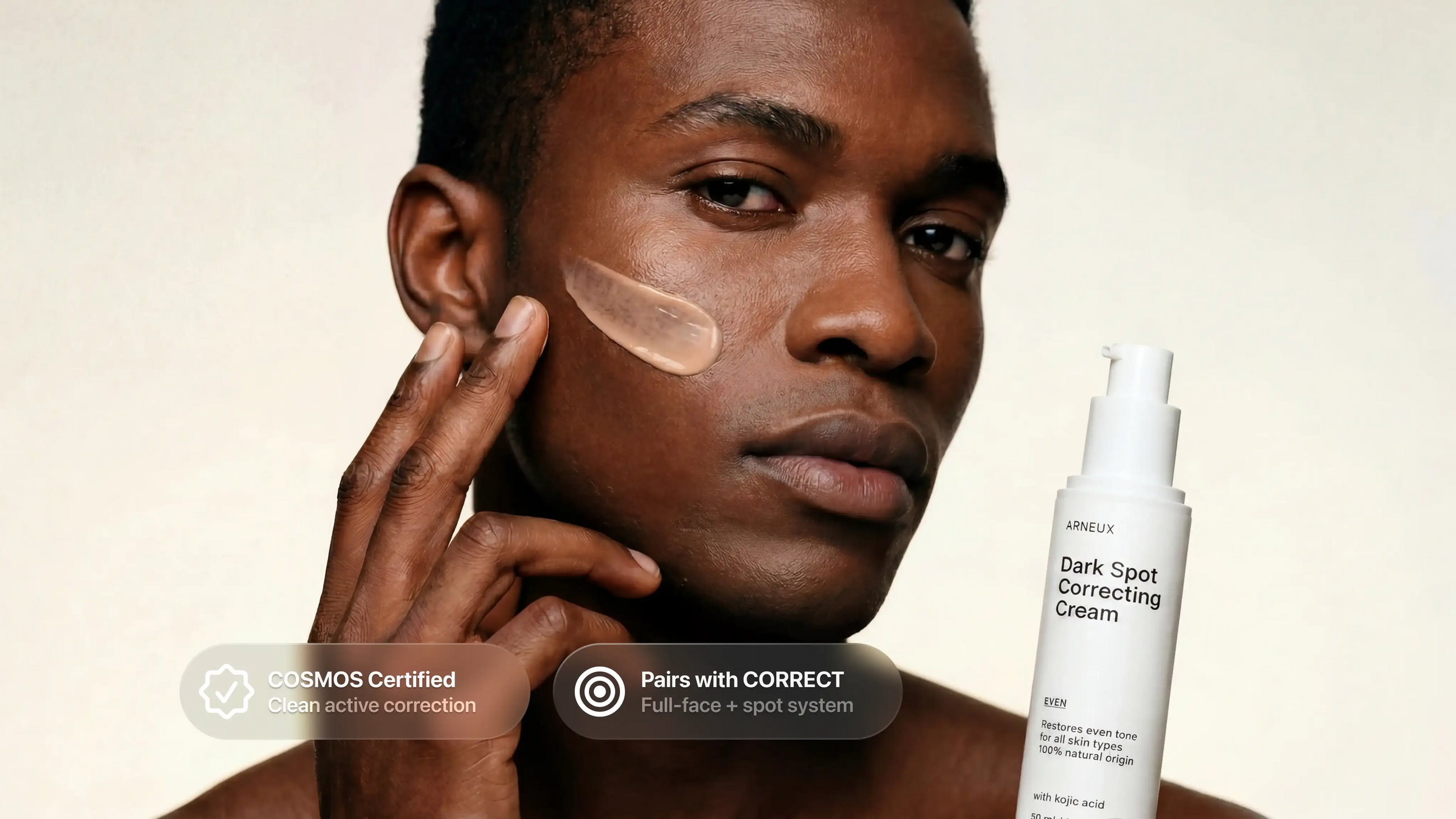 Man applying EVEN dark spot correcting cream to cheek, COSMOS certified pairs with CORRECT callout