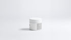 FLAWLESS purifying clay mask jar side view showing back label text on grey background