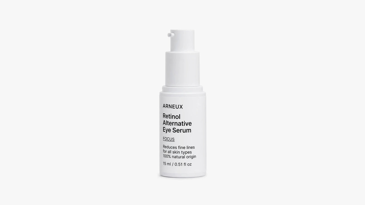 A white pump bottle of ARNEUX Retinol Alternative Eye Serum with black text, centered on a clean white background.