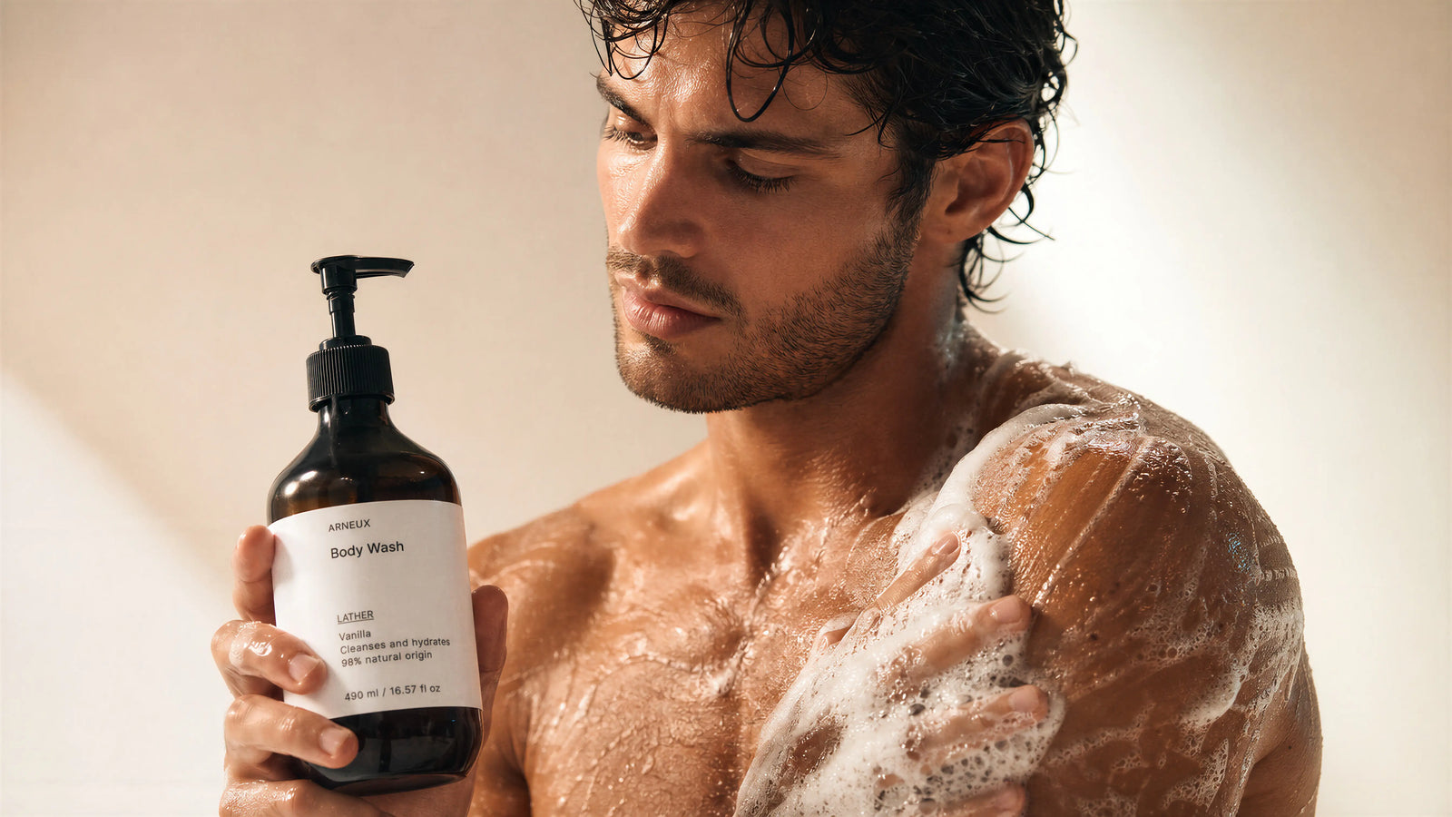 Man lathering Arneux LATHER vanilla body wash in shower, 98% natural origin body care category