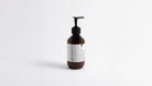 HYDRATE hydrating body lotion amber bottle side profile showing back label and pump detail