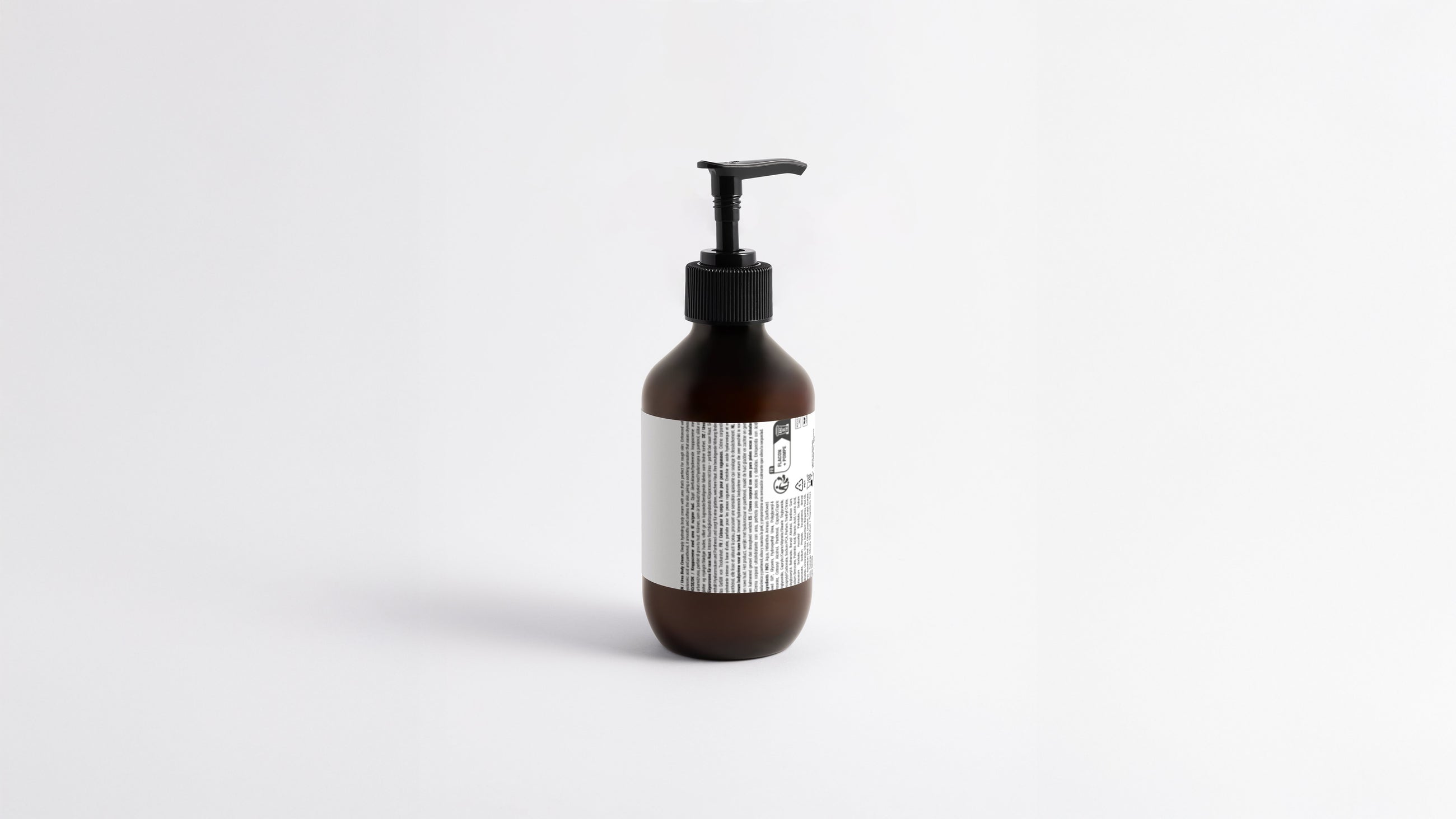 HYDRATE hydrating body lotion amber bottle side profile showing back label and pump detail