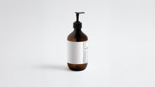 LATHER body wash amber bottle side view showing back label ingredient list