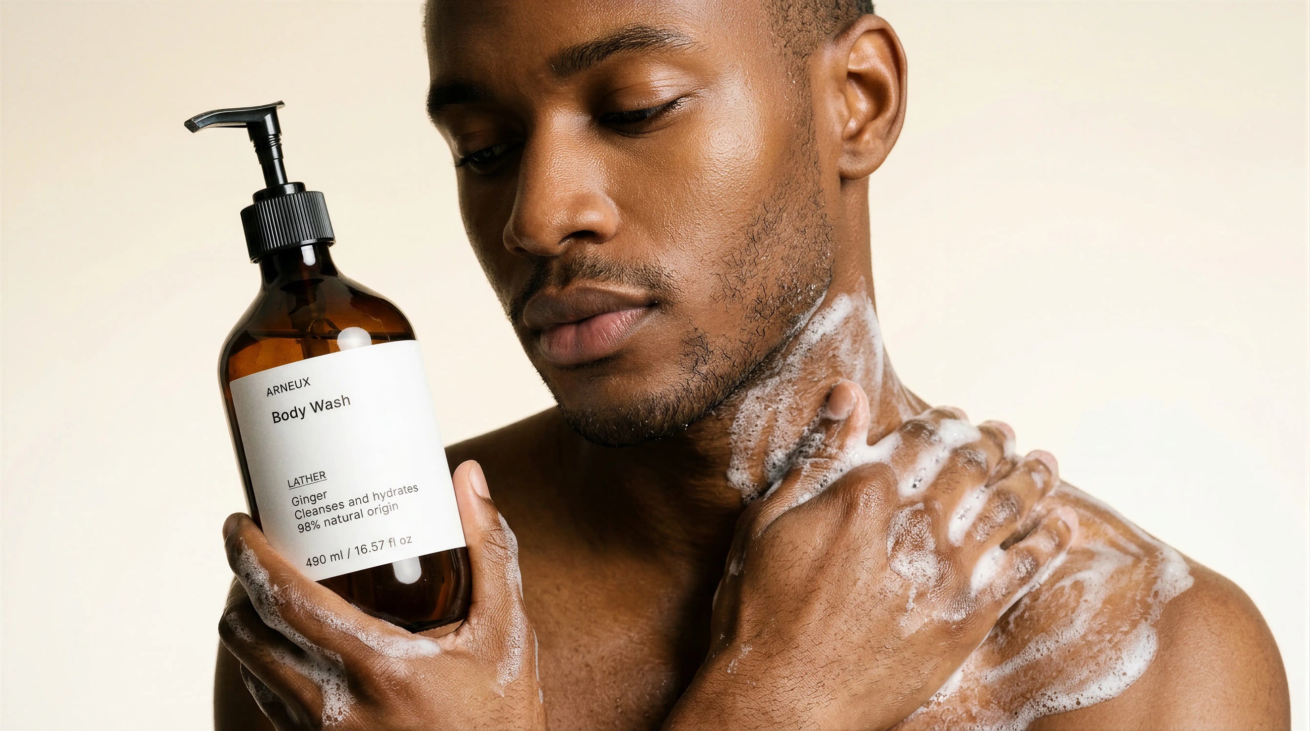 Man lathering LATHER ginger body wash on chest in shower, rich foaming clean rinse