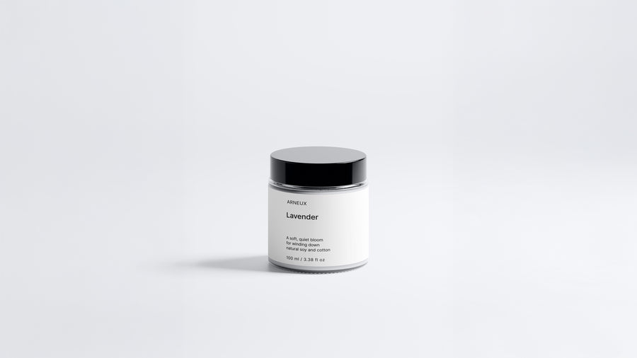 Arneux LAVENDER travel candle glass jar with black lid, calming soy wax candle front view on grey background