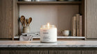 LAVENDER soy wax candle burning on marble kitchen shelf in warm Scandinavian home interior