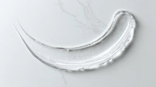 Caffeine gel booster clear lightweight gel texture swatch on white marble, instant-absorbing consistency