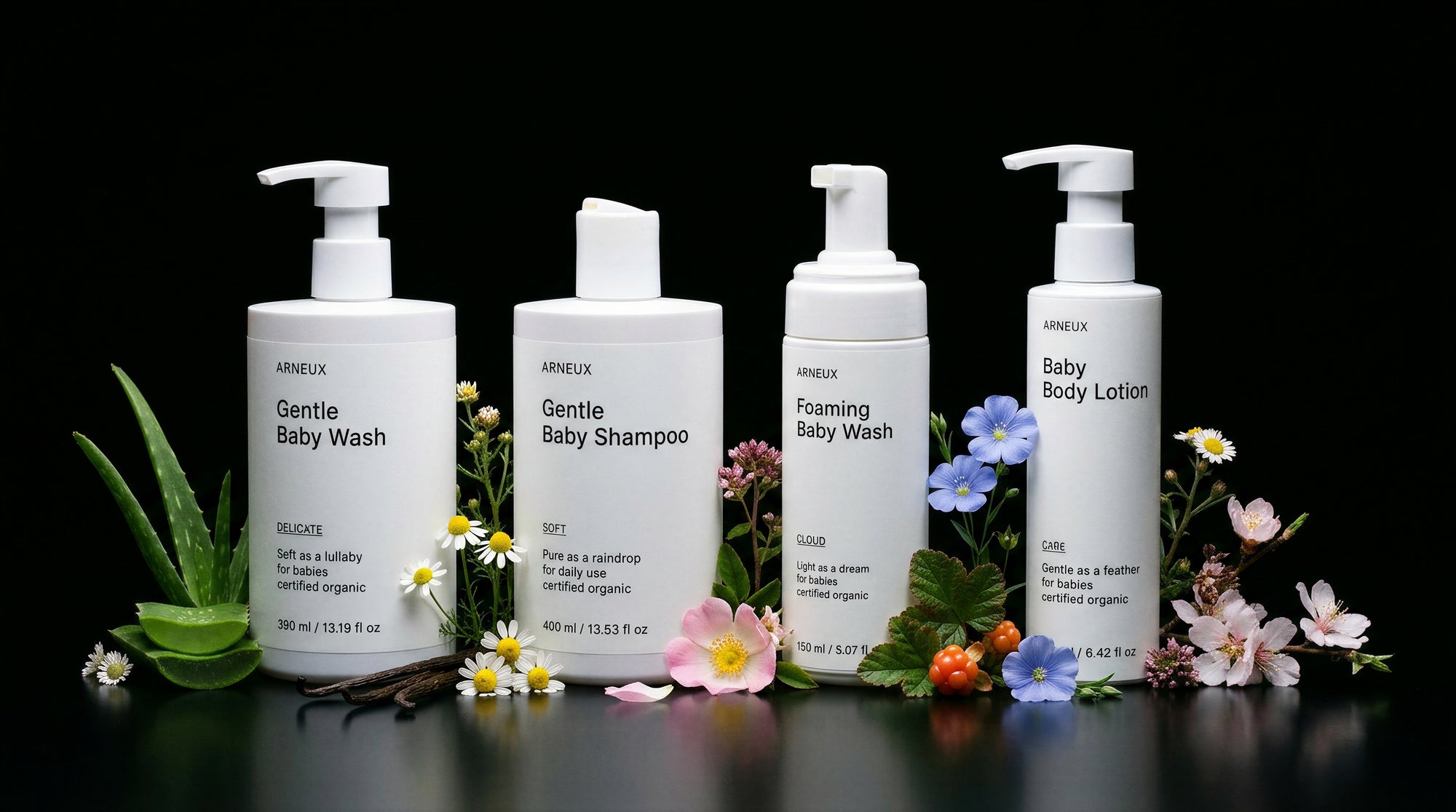LITTLE baby collection four bottles with aloe, chamomile and wildflowers on black background