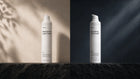 NIGHT nourishing rich cream and DAY moisturizing light cream bottles paired on dark surface