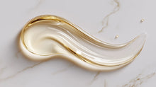 Lightweight golden oil swatch on white marble, fast-absorbing omega 6-9 texture from NOURISH body oil