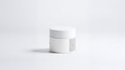 REFINE icelandic volcano scrub jar side view showing back label text on grey background