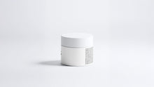 REFINE icelandic volcano scrub jar side view showing back label text on grey background