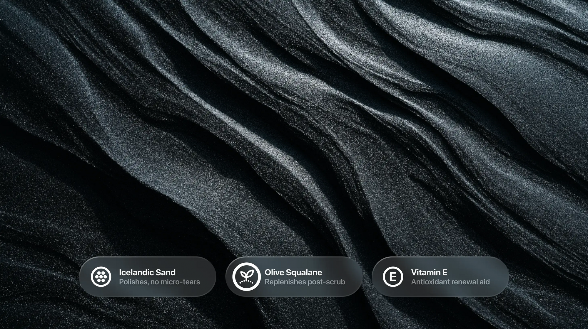Swirling dark volcanic mineral texture with Icelandic sand, olive squalane and vitamin E callouts