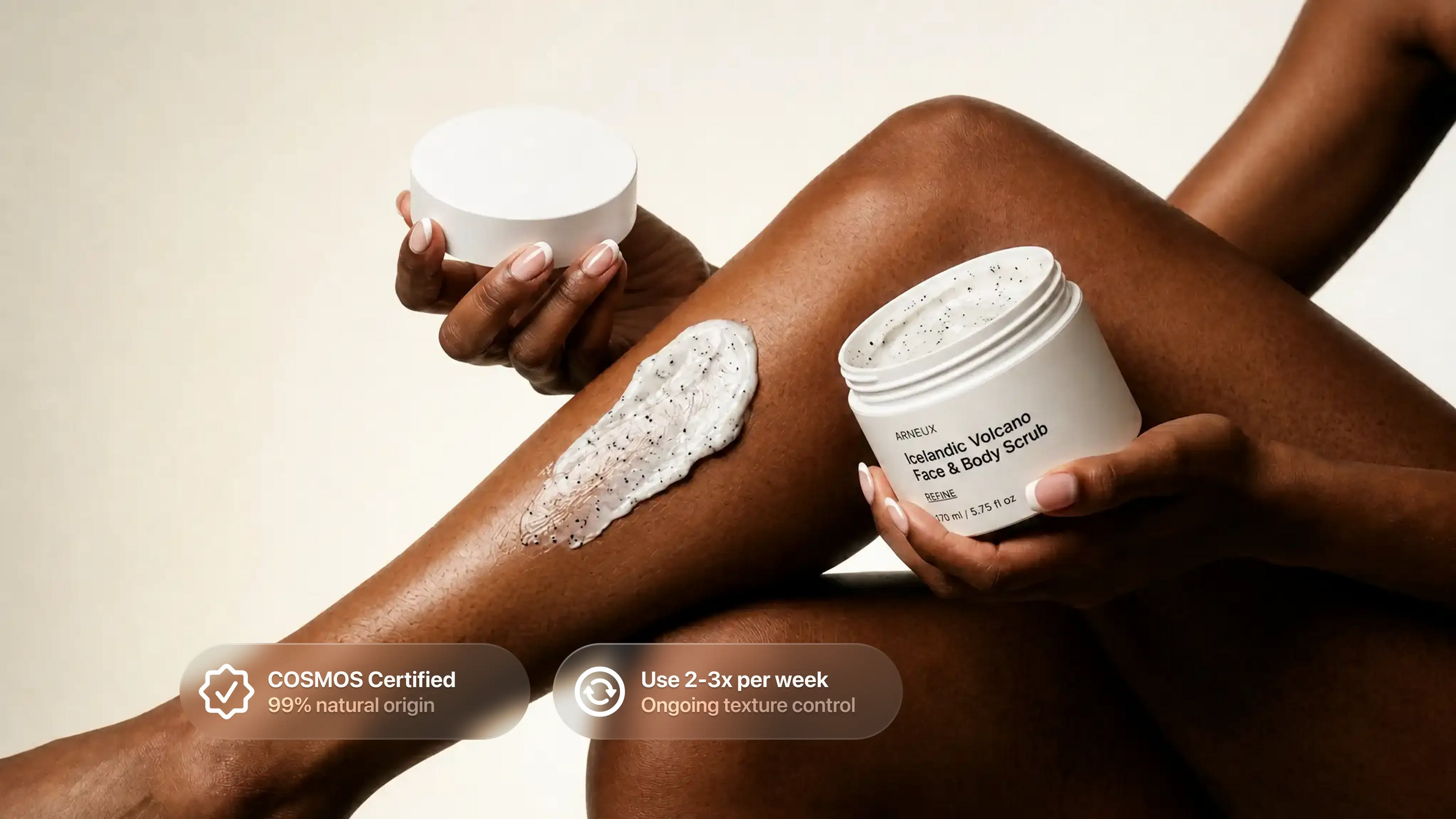Woman applying REFINE volcanic scrub to legs, COSMOS certified use 2 to 3 times per week callout