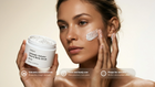 Woman applying REFINE volcanic scrub to cheek, smooths rough texture face and body use callouts