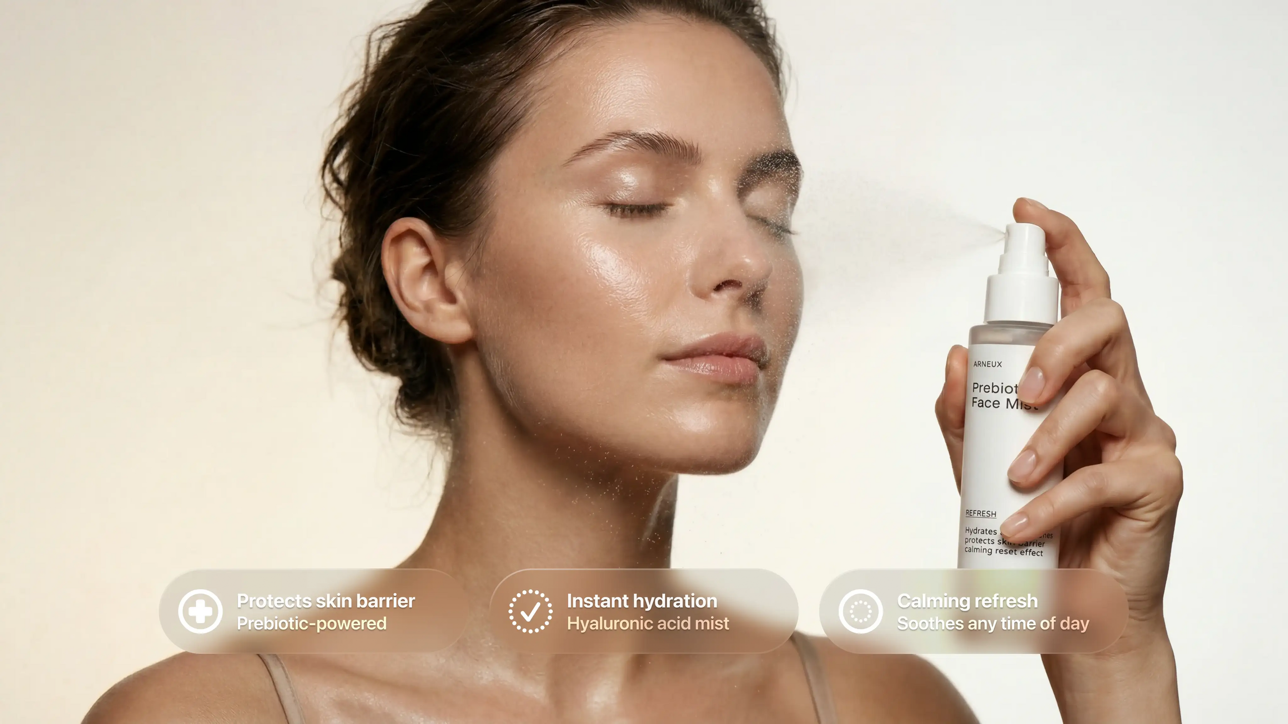 Woman misting REFRESH prebiotic face mist, eyes closed, instant hydration and skin barrier callouts