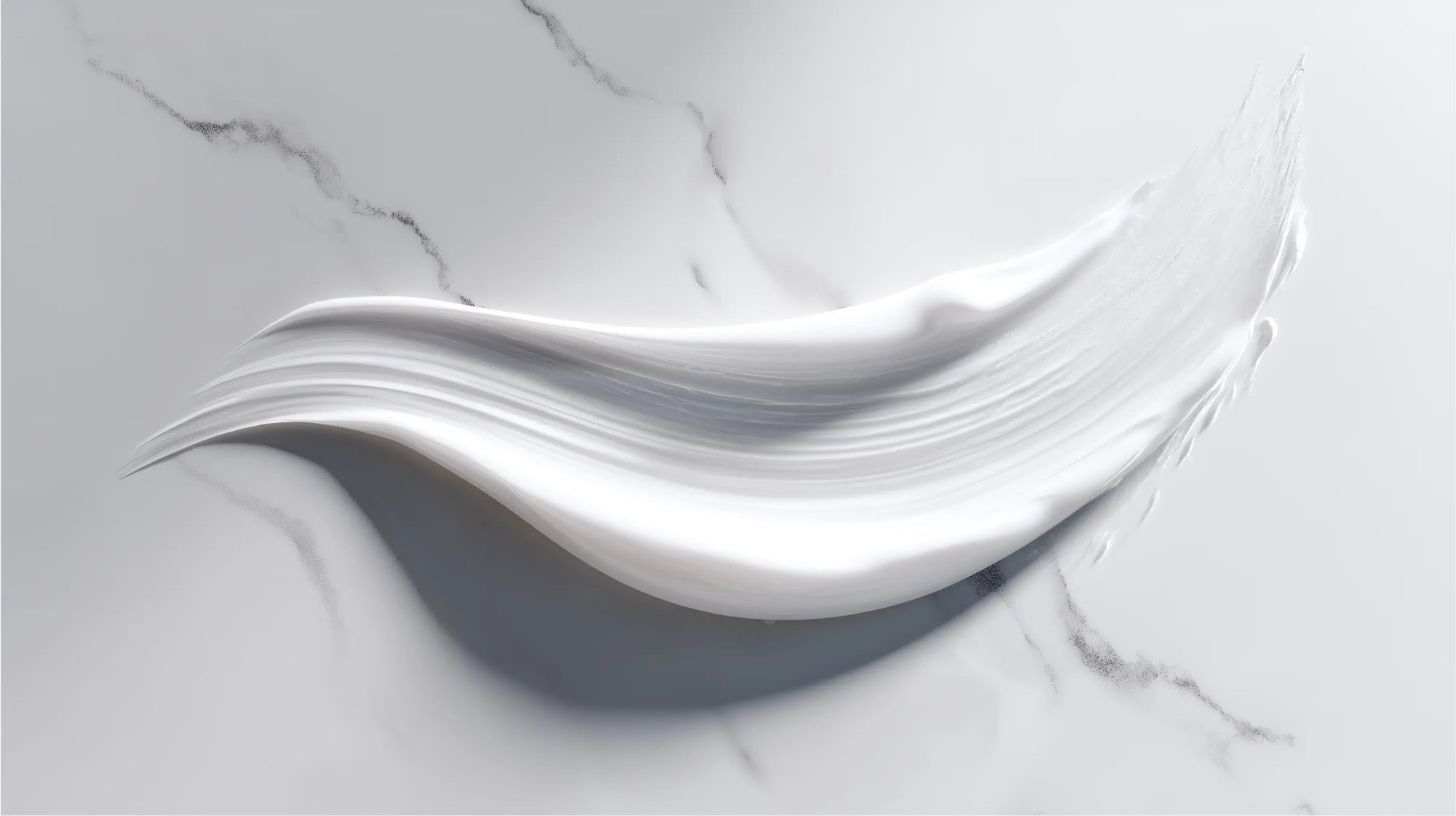 Retinol alternative moisturizer smooth cream texture swatch on white marble surface