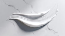 Retinol alternative moisturizer smooth cream texture swatch on white marble surface