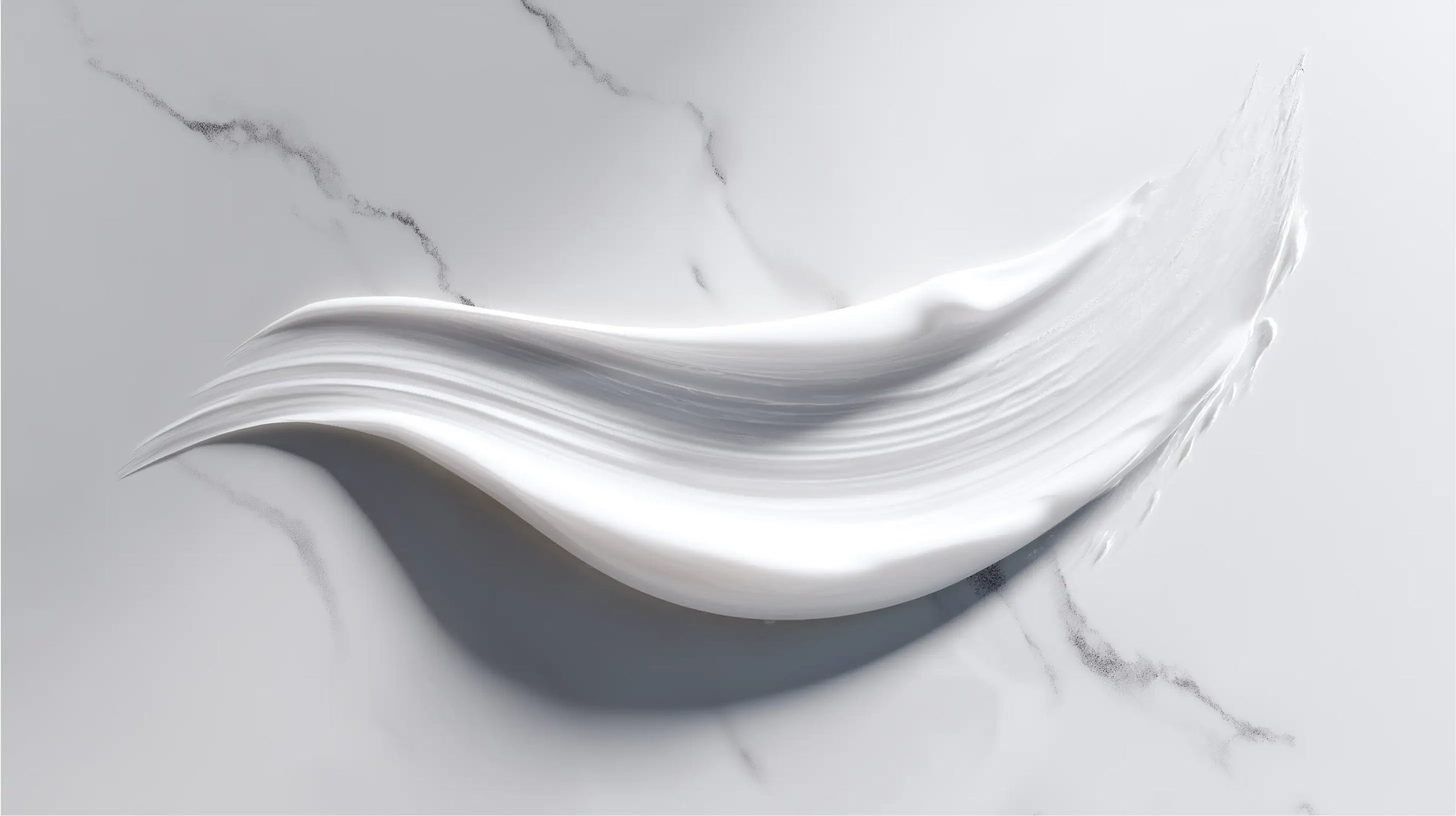 Retinol alternative moisturizer smooth cream texture swatch on white marble surface