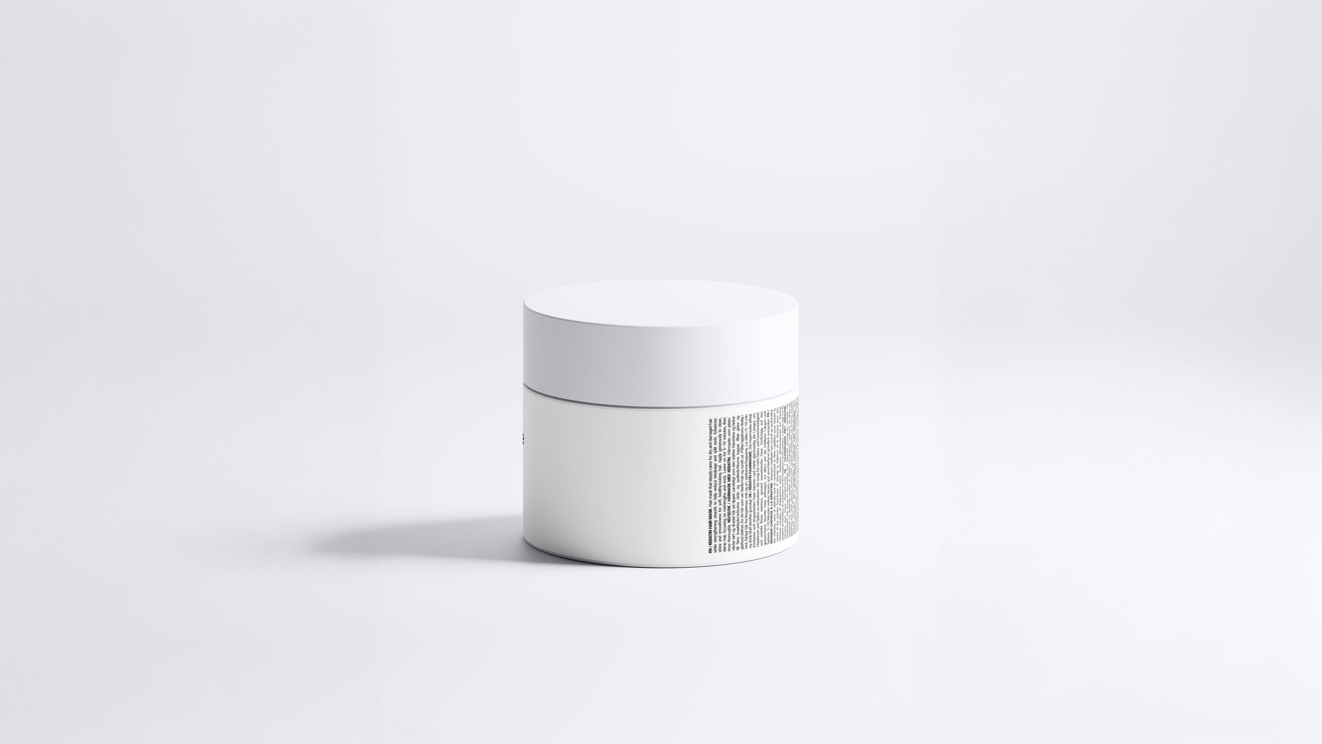 RESCUE keratin intensive hair mask jar side view showing back label text on grey background
