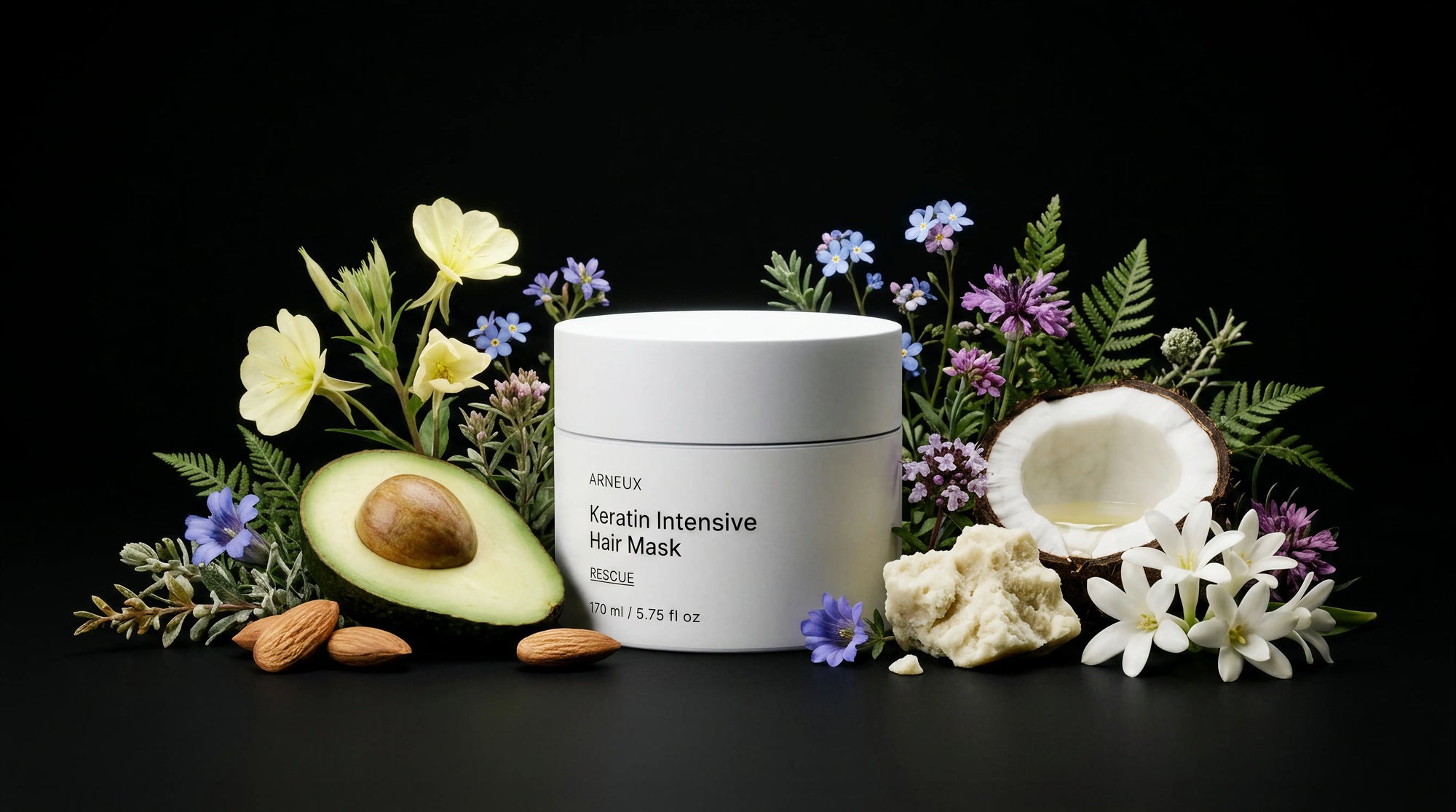 RESCUE hair mask jar with avocado, coconut, almonds, ferns and wildflowers on black background