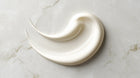 Keratin intensive hair mask thick white cream texture swatch on marble, dense repairing consistency