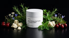 RESET hair scrub jar with rosemary, mint, edelweiss, cherries and shea butter on black background