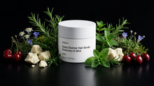 RESET hair scrub jar with rosemary, mint, edelweiss, cherries and shea butter on black background