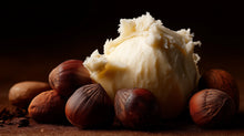 Raw shea butter chunk with shea nuts close-up, moisturizing ingredient in RESET deep cleanse hair scrub