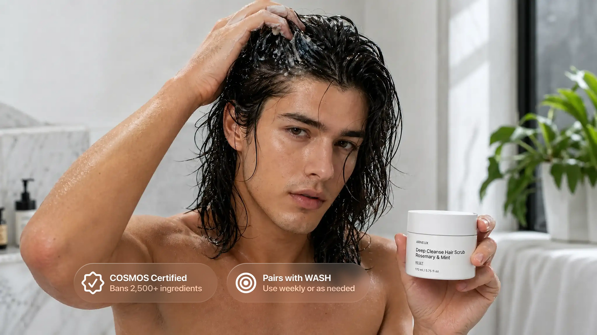 Man massaging RESET deep cleanse hair scrub into wet hair, COSMOS certified pairs with WASH callout