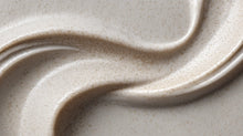 Deep cleanse hair scrub sandy texture with natural exfoliating granules close-up on beige surface