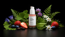 REVIVE serum bottle with strawberries, blueberries, ferns, edelweiss and wildflowers on black