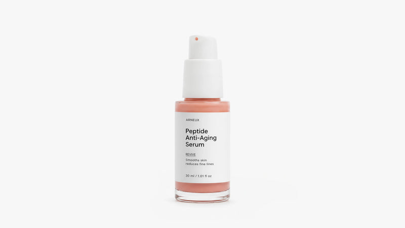 Arneux REVIVE peptide anti-aging serum pump with glass bottle, front label on grey background