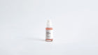Arneux REVIVE peptide anti-aging serum pump with glass bottle, front label on grey background