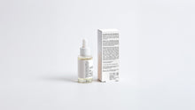 ROOT rosemary hair oil bottle beside box back panel showing full ingredient list