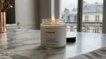 Arneux LAVENDER travel candle burning on marble surface, soft quiet bloom natural soy wax evening ritual
