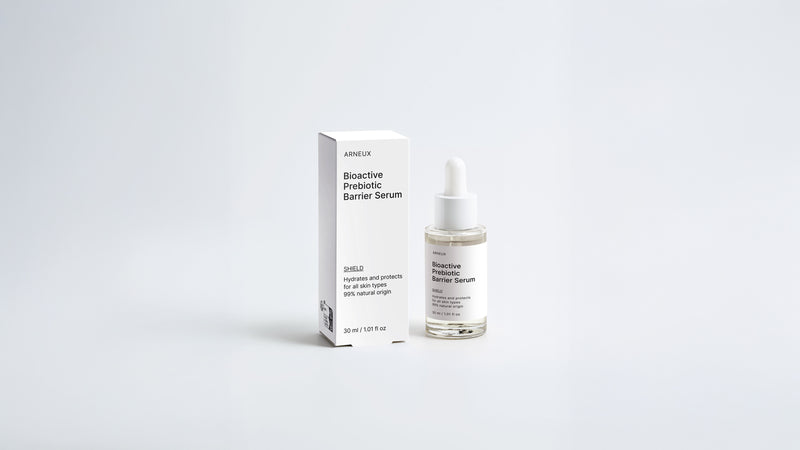 SHIELD prebiotic barrier serum dropper bottle and box packaging set on grey background