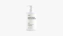 A white pump bottle of Arneux Keratin Volume Boost Conditioner, photographed against a seamless light gray studio background