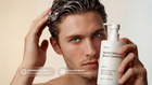 Man applying SMOOTH keratin volume conditioner to wet hair, COSMOS certified pairs with WASH callout
