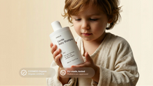 Young boy holding SOFT baby shampoo, COSMOS Organic certified EU-made tested pediatrician approved callouts
