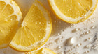 Fresh lemon slices with water droplets close-up, vitamin C citrus ingredient in keratin hair mist