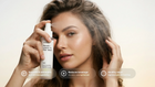 Woman running fingers through hair holding TAME keratin mist, smooths detangles and reduces breakage callouts