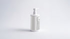 WASH keratin volume boost shampoo bottle side view showing back label on grey background