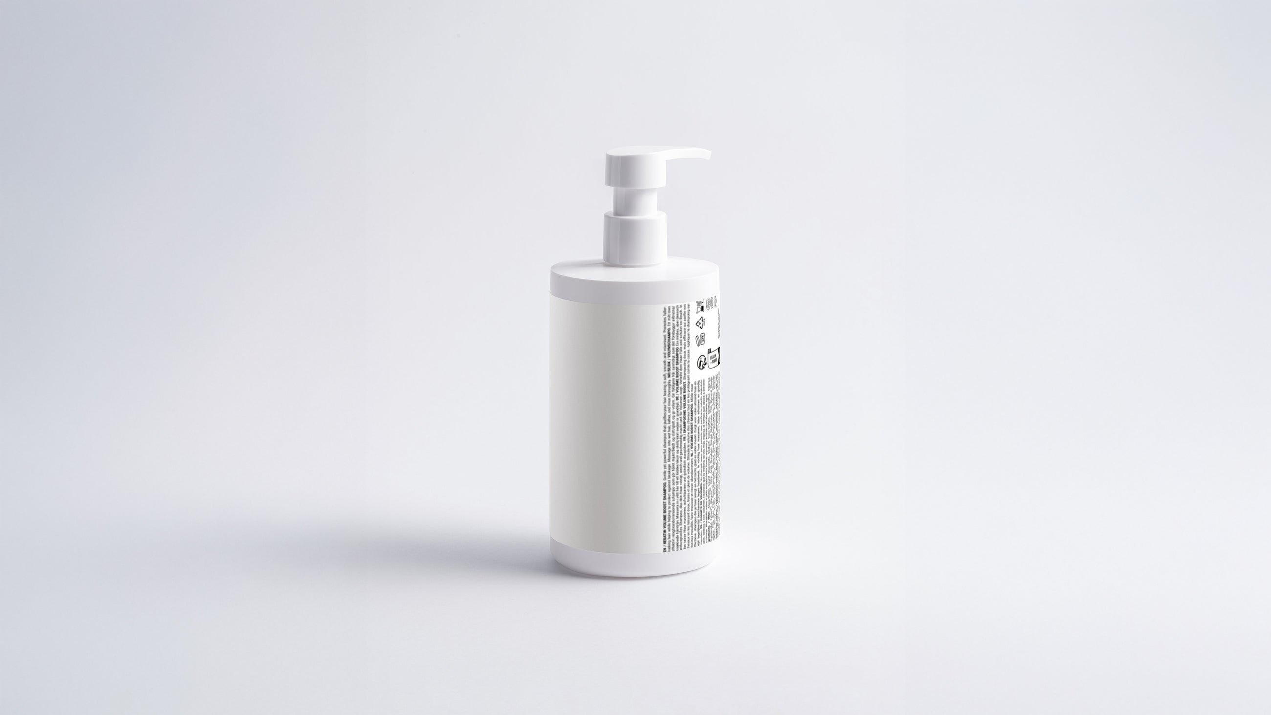 WASH keratin volume boost shampoo bottle side view showing back label on grey background