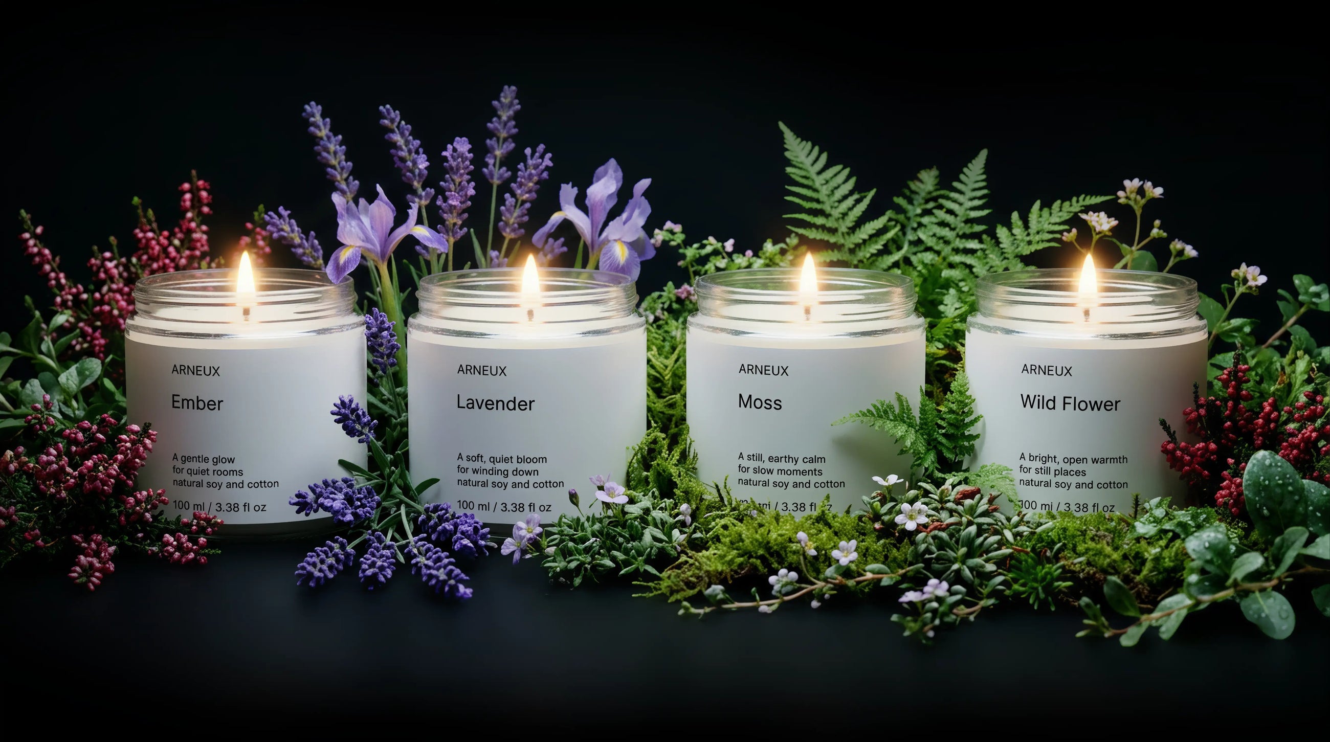 ARNEUX ILLUMINATE candle set with lavender and wild flower botanicals on dark background