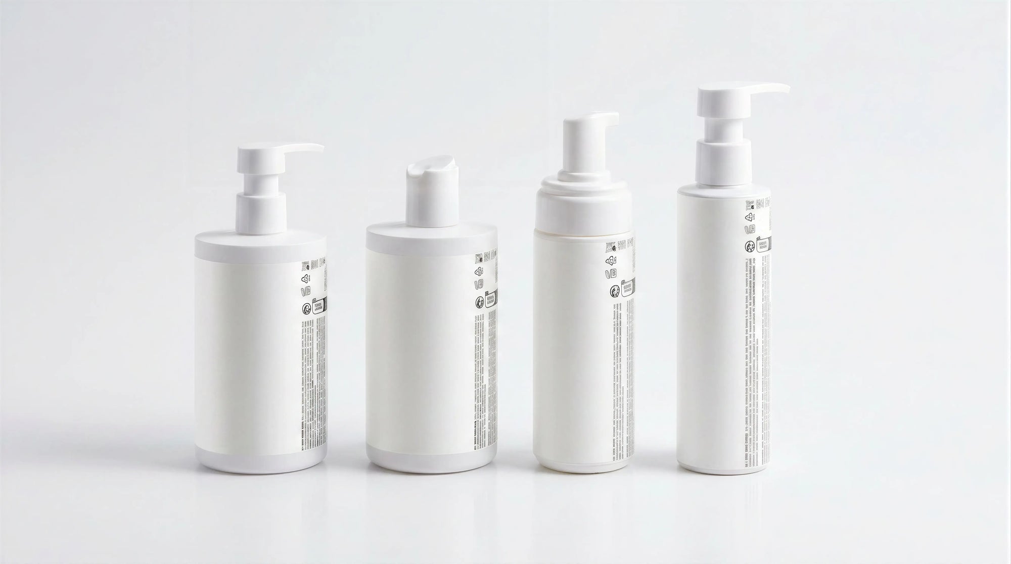 LITTLE baby collection four bottles showing side labels on marble, full product set back view