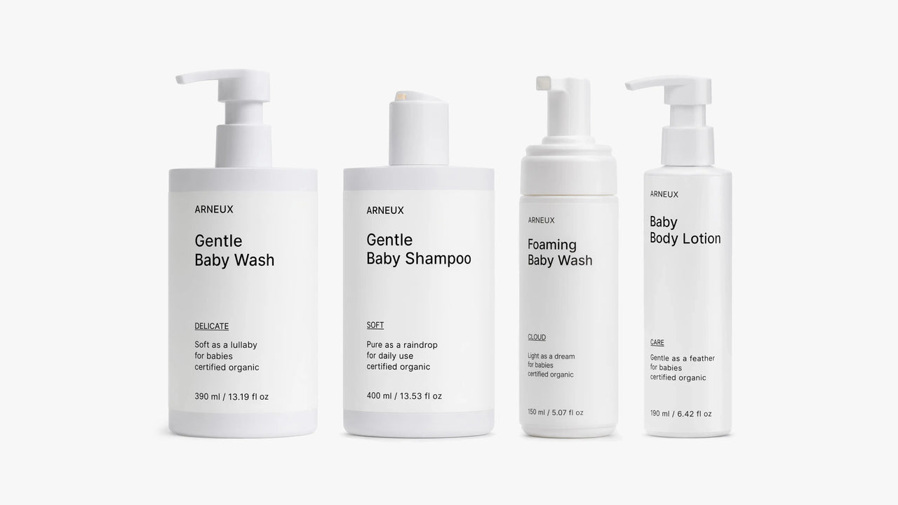 Four bottles of ARNEUX SOFT DELICATE CLOUD and CARE products on a white background
